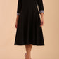 Model wearing Diva catwalk Coralia swing dress in black/ slate grey with three quarter sleeve figure fitted front image