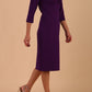 Model wearing Diva catwalk Venetia pencil figure fitted dress in deep purple with three quarter sleeve front