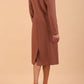 brunette model wearing diva catwalk cora white pencil dress with long sleeves and rounded neckline with pockets in colour acorn brown on side back