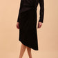 Brunette Model wearing assymetric glitter and black velvet long sleeve dress front image