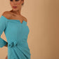 model is wearing diva catwalk charisma dress odd shoulder design with pleated detail down the front and flower detail on a side in celeste blue colour