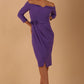 model is wearing diva catwalk charisma dress odd shoulder design with pleated detail down the front and flower detail on a side in opulent violet colour