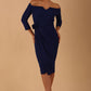 model is wearing diva catwalk charisma dress odd shoulder design with pleated detail down the front and flower detail on a side in oxford blue colour