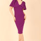 brunette model is wearing diva catwalk hermione pencil dress with tie shoulder details and empire waistline in Deep Purple front