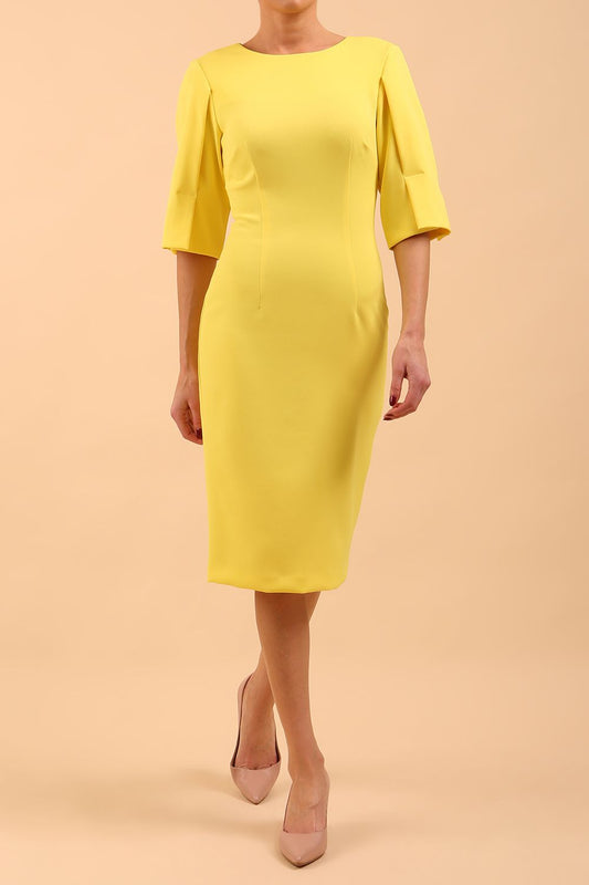 model is wearing divacatwalk chiswick pencil dress rounded neck with short sleeve in blazing yellow front