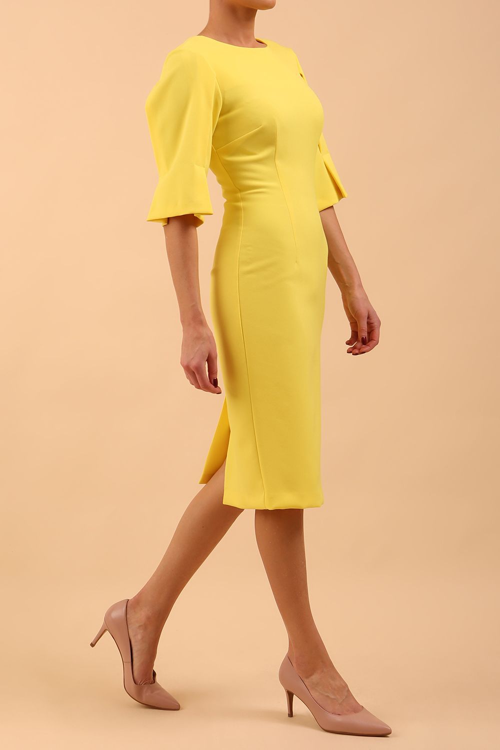 model is wearing divacatwalk chiswick pencil dress rounded neck with short sleeve in blazing yellow front side