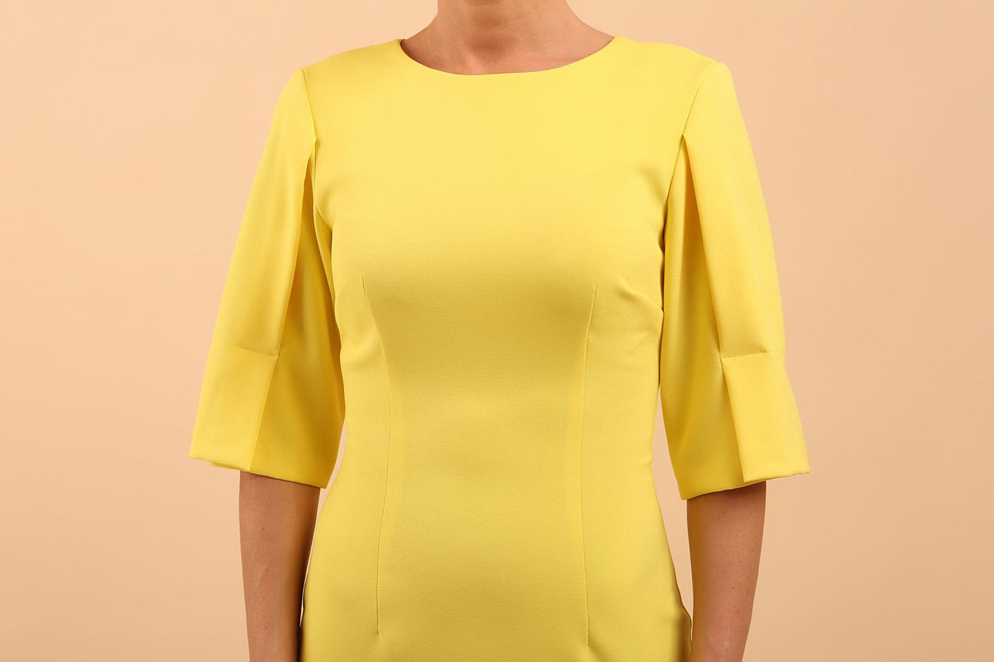 model is wearing divacatwalk chiswick pencil dress rounded neck with short sleeve in blazing yellow front close up