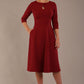 model is wearing diva catwalk casares swing dress with a keyhole neckline three quarter sleeve dress with pocket detail in Wine front side (Wine)