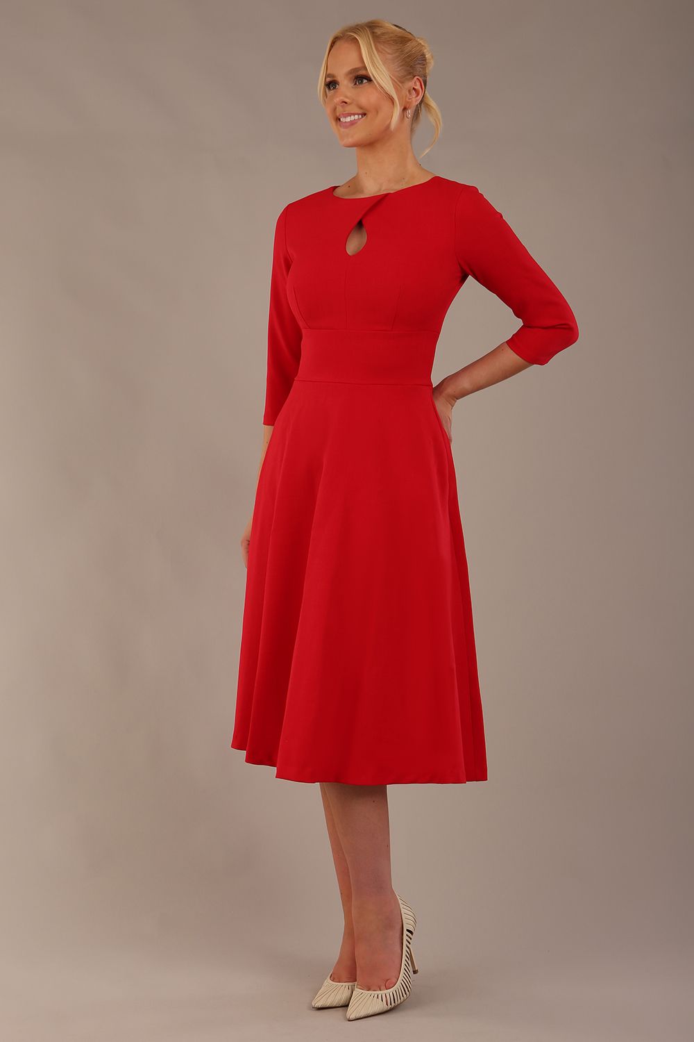 model is wearing diva catwalk casares swing dress with a keyhole neckline three quarter sleeve dress with pocket detail in red front (Scarlet Red)
