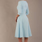 model is wearing diva catwalk casares swing dress with a keyhole neckline three quarter sleeve dress with pocket detail in sky blue back side (Sky Blue)