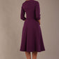 model is wearing diva catwalk casares swing dress with a keyhole neckline three quarter sleeve dress with pocket detail in imperial purple back (Imperial Purple)