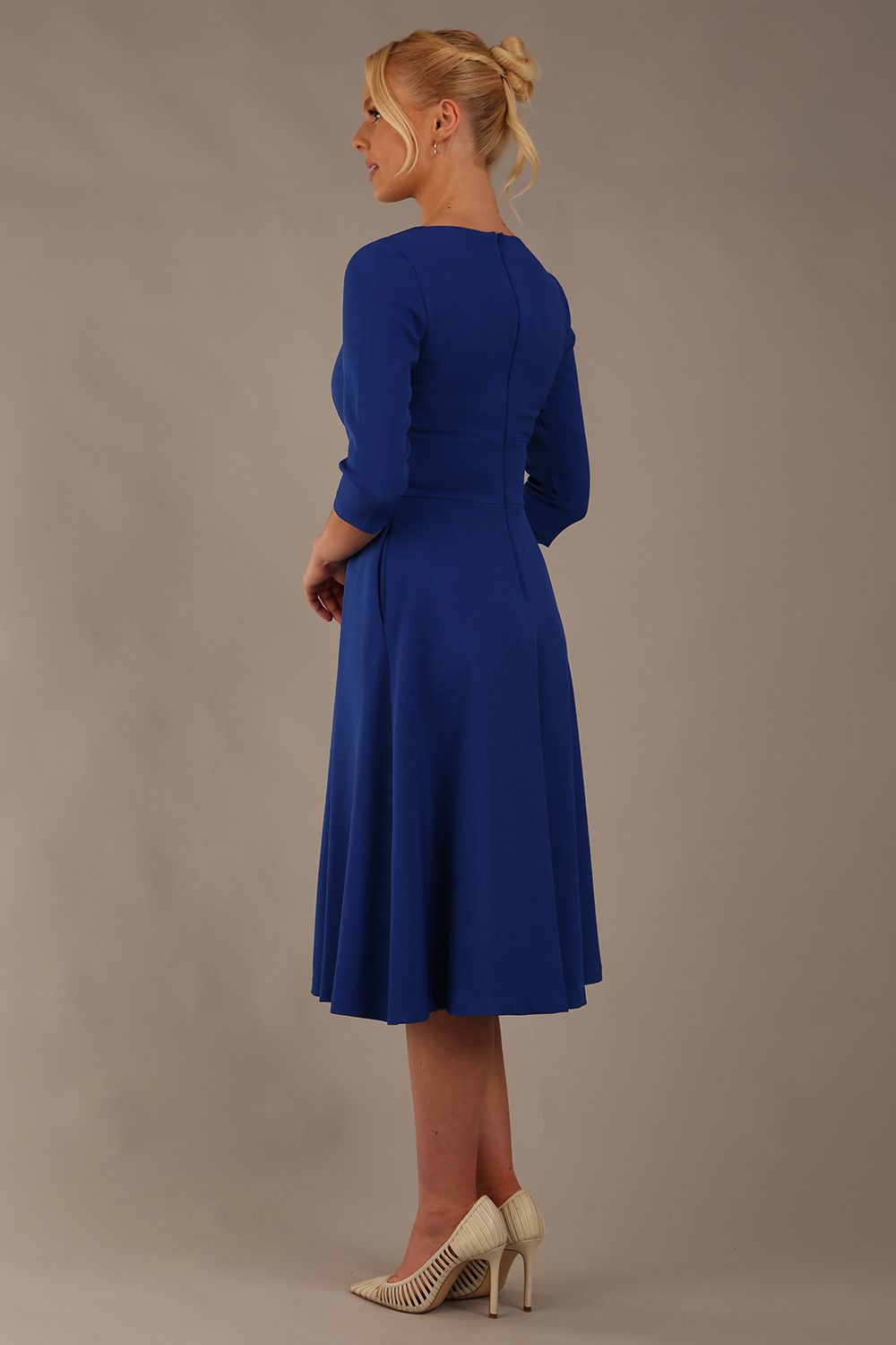 model is wearing diva catwalk casares swing dress with a keyhole neckline three quarter sleeve dress with pocket detail in cobalt blue back (Cobalt Blue)