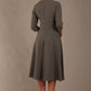 model is wearing diva catwalk casares swing dress with a keyhole neckline three quarter sleeve dress with pocket detail in Castlerock Grey  back (Castlerock Grey)