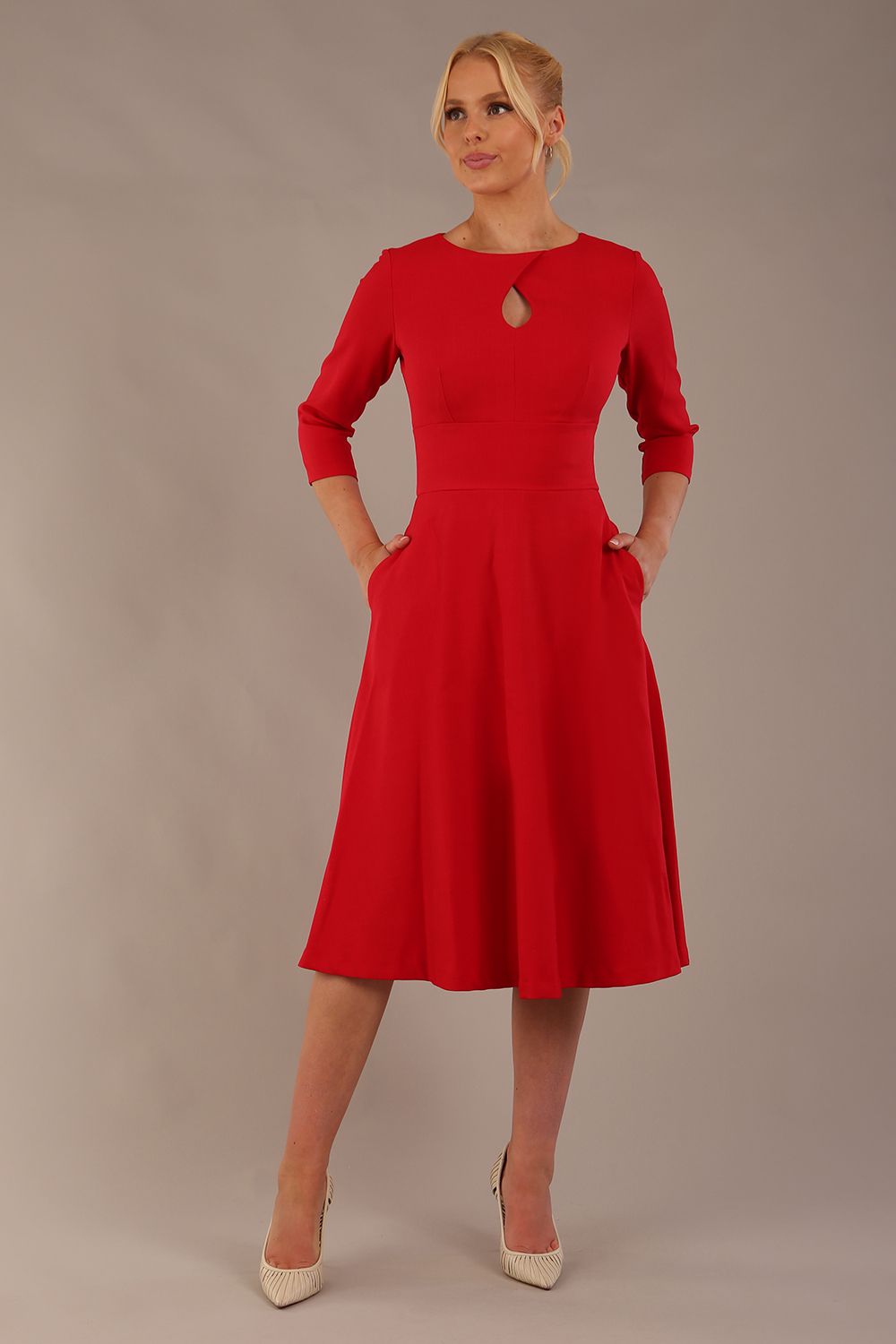 model is wearing diva catwalk casares swing dress with a keyhole neckline three quarter sleeve dress with pocket detail in red front (Scarlet Red)