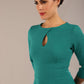 Brunette model is wearing diva catwalk casares swing dress with a keyhole neckline three quarter sleeve dress with pocket detail in Parasailing green close up