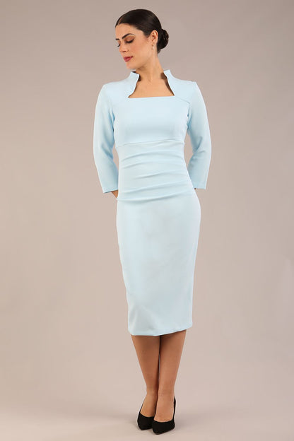 model is wearing diva catwalk plaza sheath dress with high neck Trapezium neckline cutout and three quarter sleeve pretty dress in sky blue front