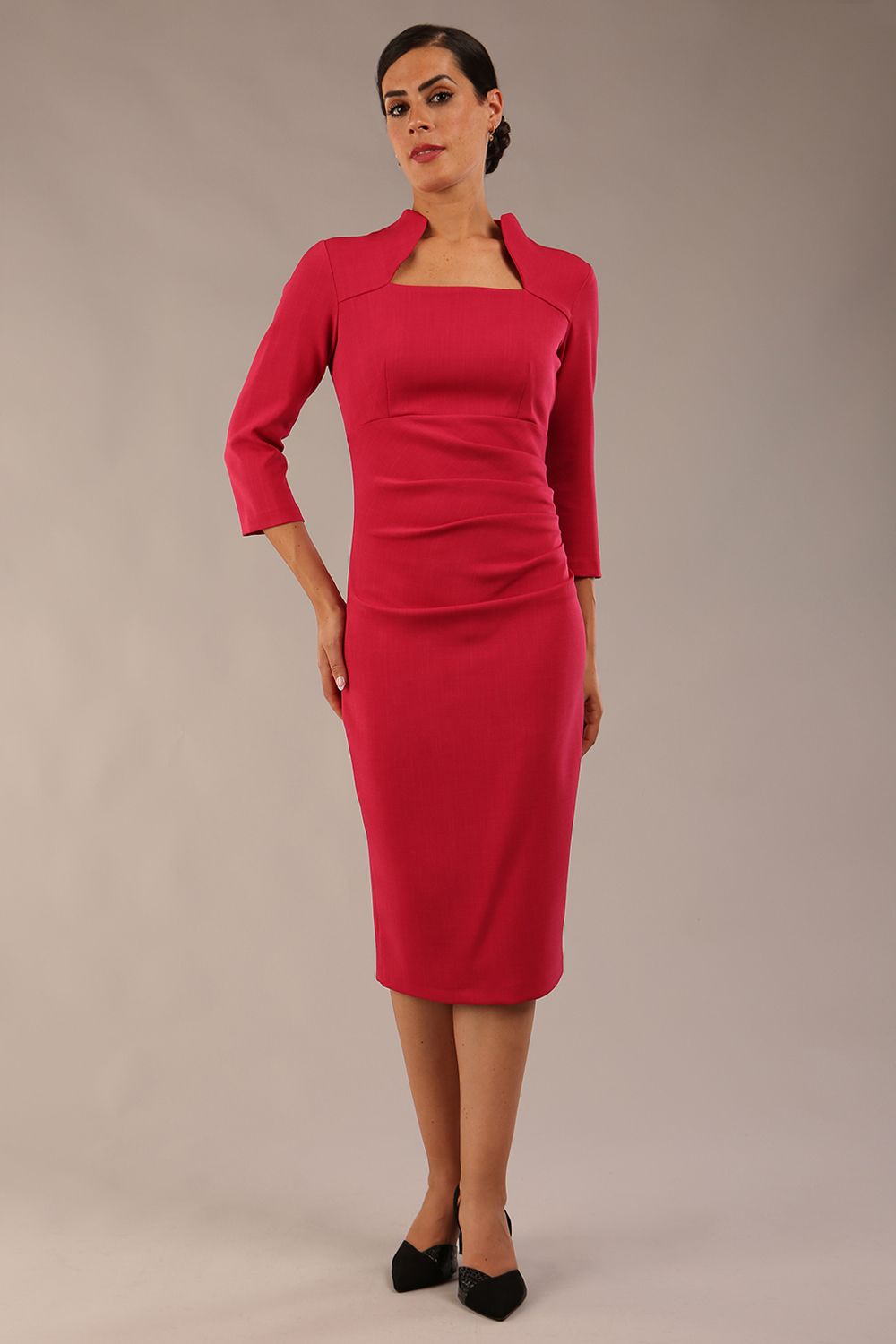 model is wearing diva catwalk plaza sheath dress with high neck Trapezium neckline cutout and three quarter sleeve pretty dress in Raspberry pink colour