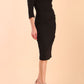model is wearing diva catwalk plaza sheath dress with high neck Trapezium neckline cutout and three quarter sleeve pretty dress in black front