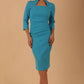 model is wearing diva catwalk plaza sheath dress with high neck Trapezium neckline cutout and three quarter sleeve pretty dress in azure blue colour