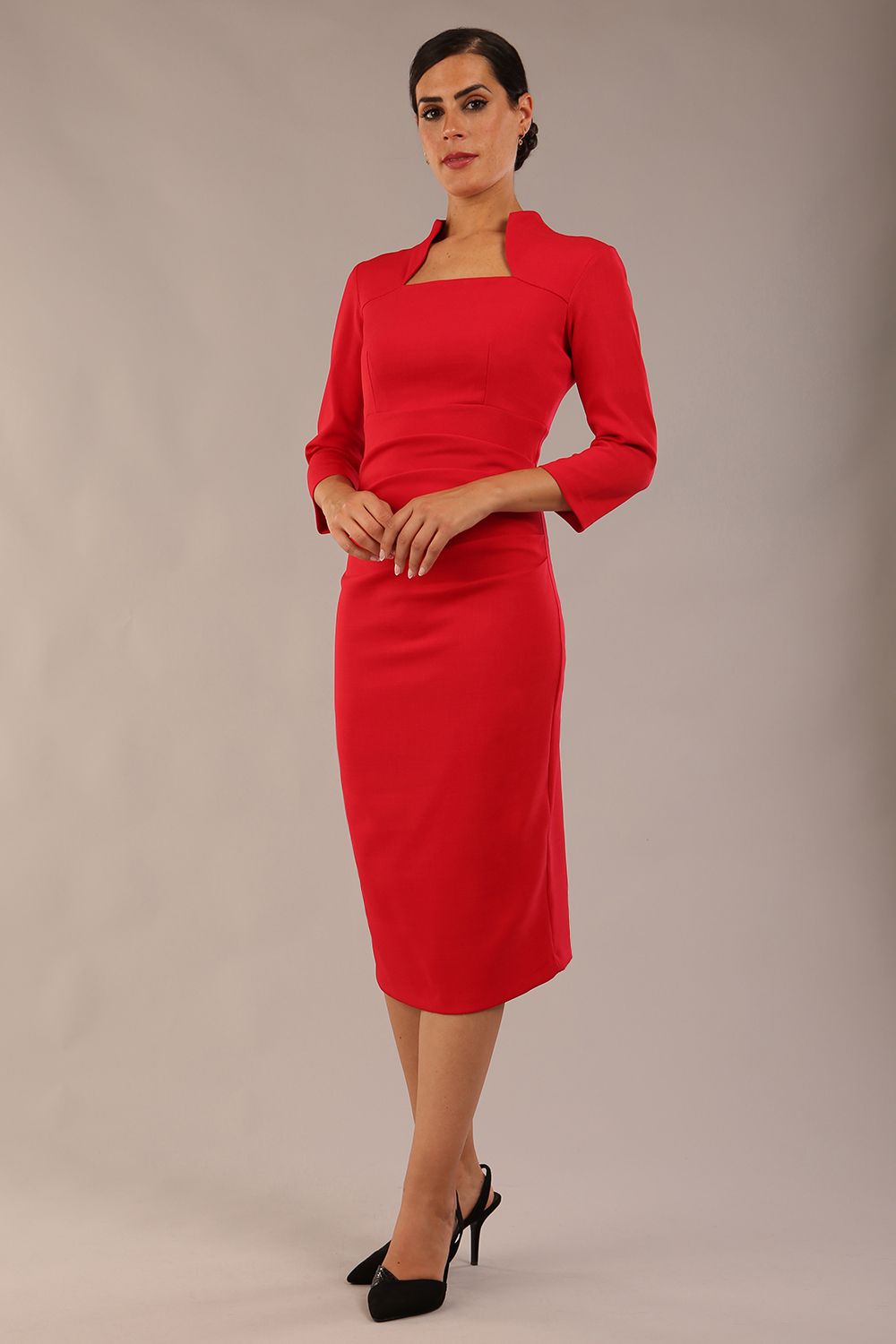 model is wearing diva catwalk plaza sheath dress with high neck Trapezium neckline cutout and three quarter sleeve pretty dress in Scarlet Red colour