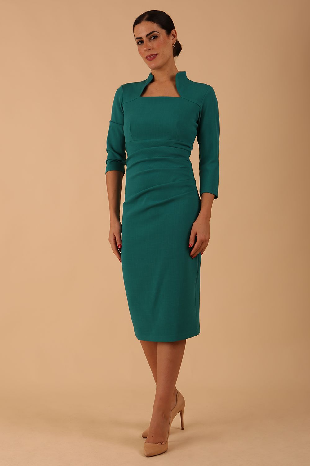 model is wearing diva catwalk plaza sheath dress with high neck Trapezium neckline cutout and three quarter sleeve pretty dress in parasailing green colour