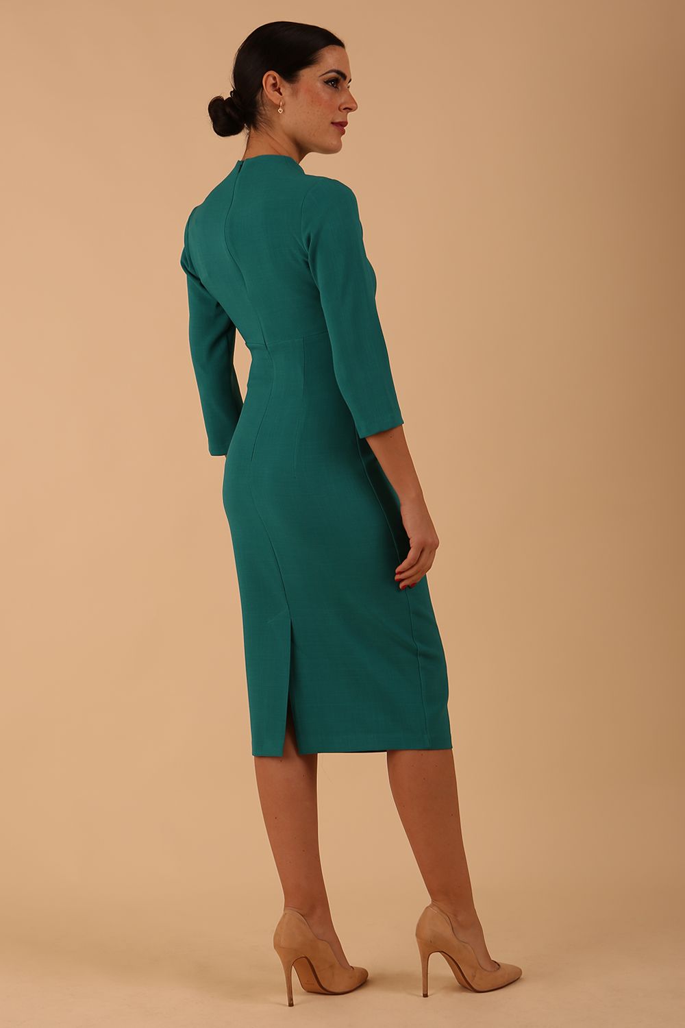model is wearing diva catwalk plaza sheath dress with high neck Trapezium neckline cutout and three quarter sleeve pretty dress in parasailing green colour