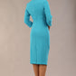 model is wearing diva catwalk plaza sheath dress with high neck Trapezium neckline cutout and three quarter sleeve pretty dress in azure blue colour