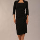 model is wearing diva catwalk plaza sheath dress with high neck Trapezium neckline cutout and three quarter sleeve pretty dress in black front