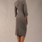 model is wearing diva catwalk plaza sheath dress with high neck Trapezium neckline cutout and three quarter sleeve pretty dress in castlerock grey colour