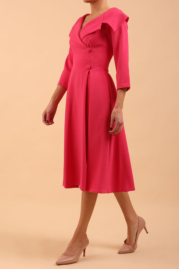 model is wearing a sleeved oversized collar swing dress with button detail at the front and pockets in the skirtmodel is wearing diva catwalk gatsby swing dress with pocket detail and wide v-neck collar and buttons down the front panel in fuchsia pink front
