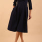 model is wearing a sleeved oversized collar swing dress with button detail at the front and pockets in the skirtmodel is wearing diva catwalk gatsby swing dress with pocket detail and wide v-neck collar and buttons down the front panel in navy blue front