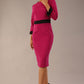 Model wearing diva catwalk Reese 3/4 Sleeved pencil skirt dress with a contrast sleeve and waistband details in Magenta/Black