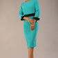 Model wearing diva catwalk Reese 3/4 Sleeved pencil skirt dress with a contrast sleeve and waistband details in Aqua Green/Black