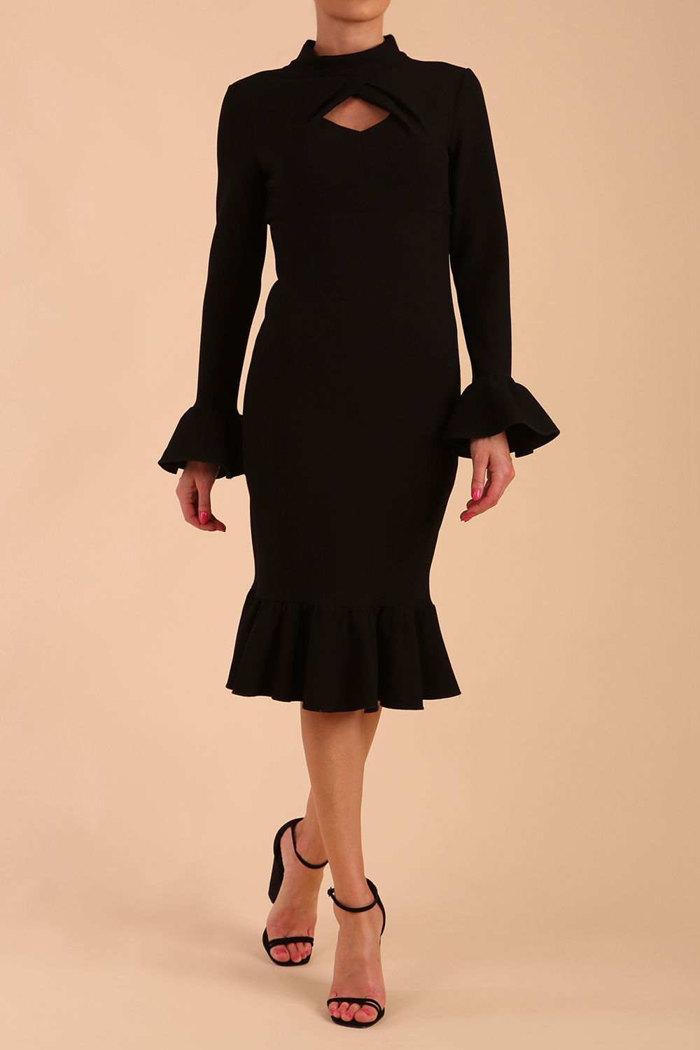 Model wearing Macarena Peplum Hem Bodycon Pencil Dress with Long sleeves with peplum details at the ends and High neckline with overlapping keyhole detail in Black colour front