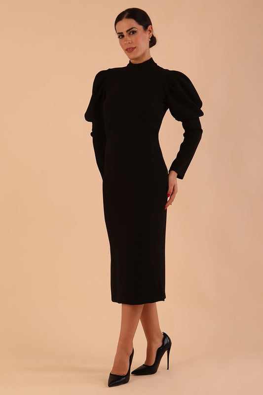 Brunette model wearing a DIVA Catwalk Buffy Puffed Long Sleeve Midi Pencil Dress with high neckline in Black