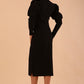 Brunette model wearing a DIVA Catwalk Buffy Puffed Long Sleeve Midi Pencil Dress with high neckline in Black