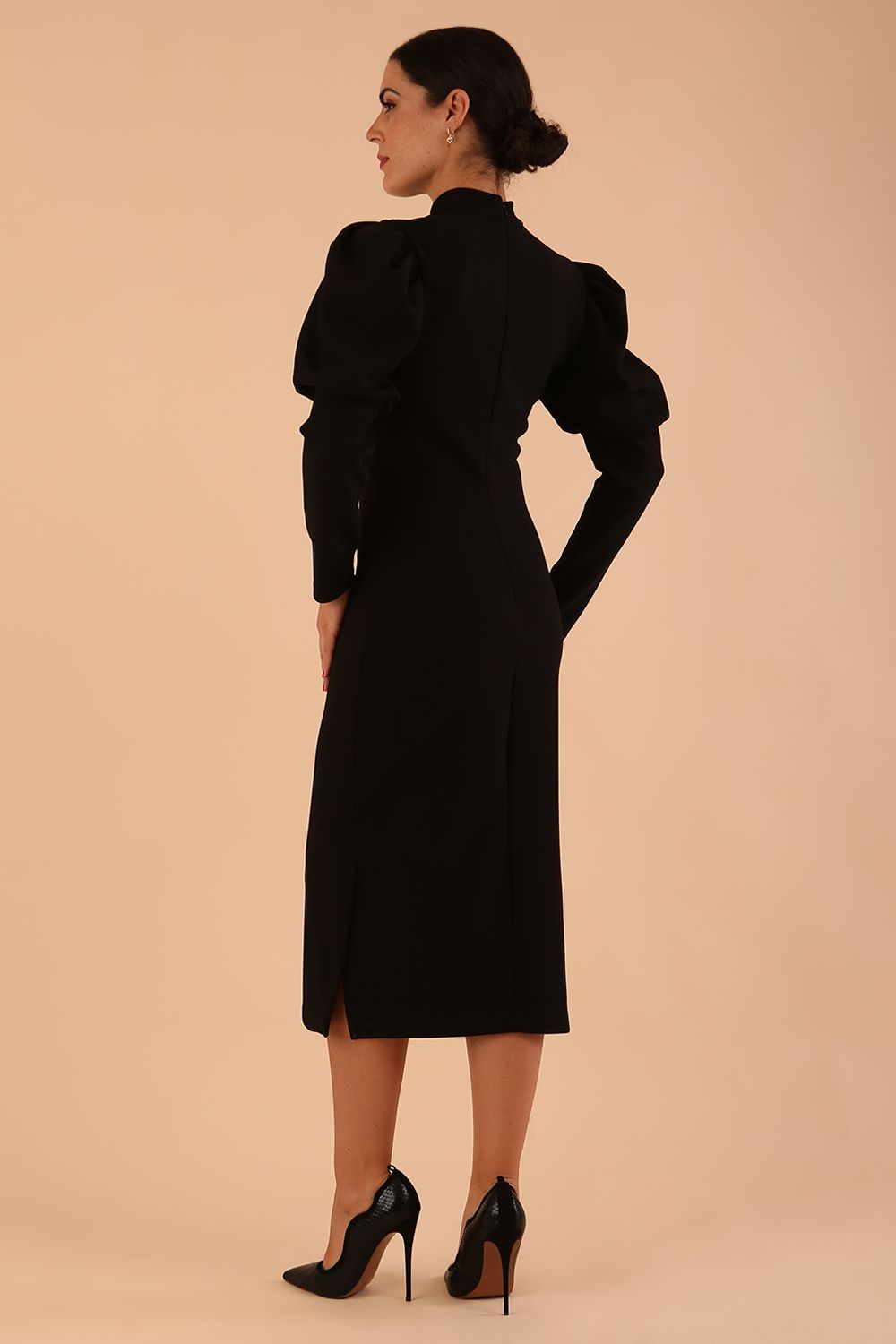 Brunette model wearing a DIVA Catwalk Buffy Puffed Long Sleeve Midi Pencil Dress with high neckline in Black