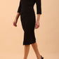 model is wearing diva catwalk liesel wrap pencil sleeved dress with collar half way around low v-neck in black front
