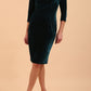A model is wearing a velvet pencil sweetheart neckline dress by diva catwalk in teal
