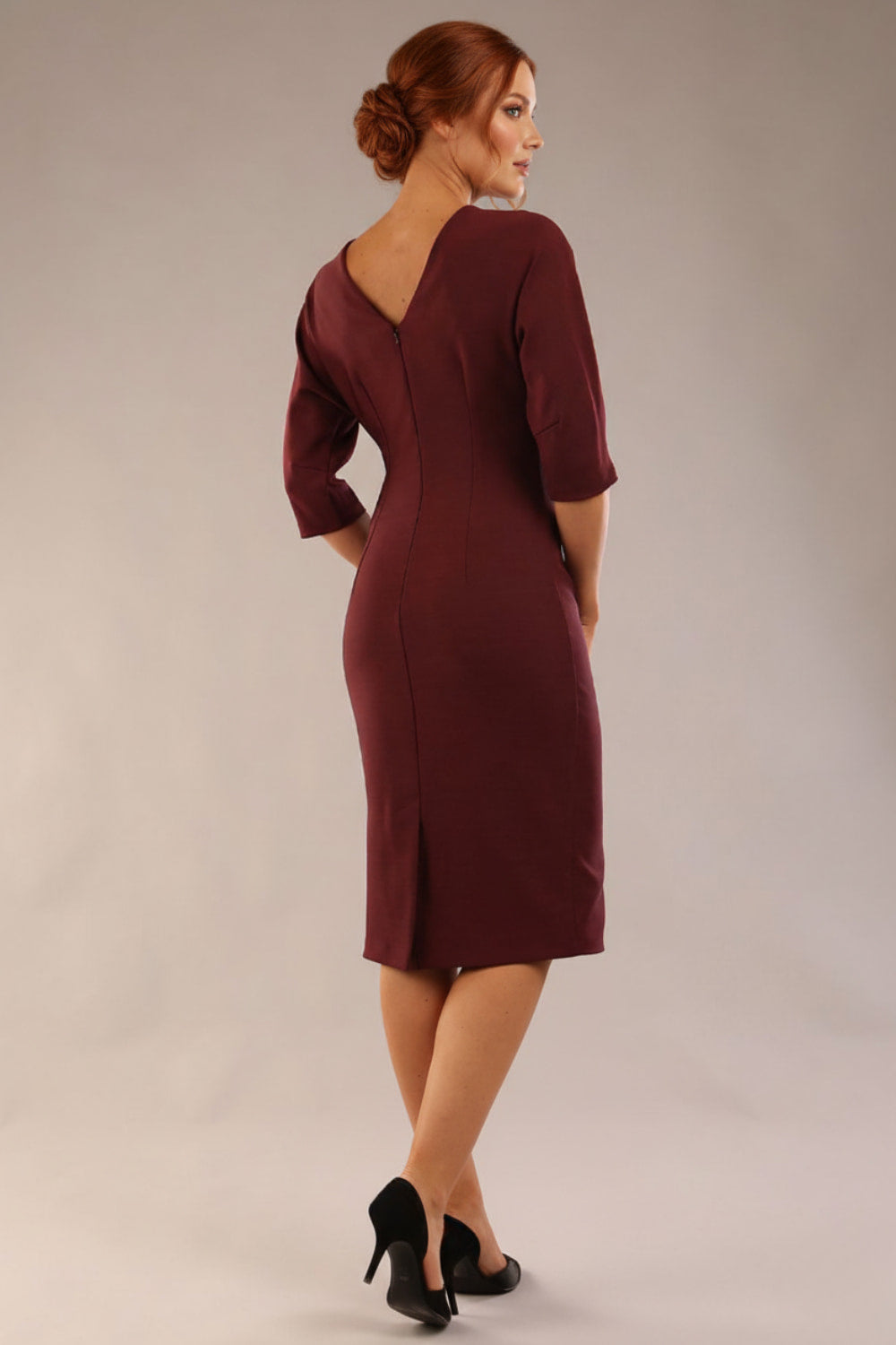 Model wearing the SEED Fulham pencil dress in port royale, showing the clean boat neckline and dolman sleeves (Port Royale)