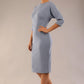 Model wearing the SEED Fulham pencil dress in port royale, showing the clean boat neckline and dolman sleeves (Steel Blue)