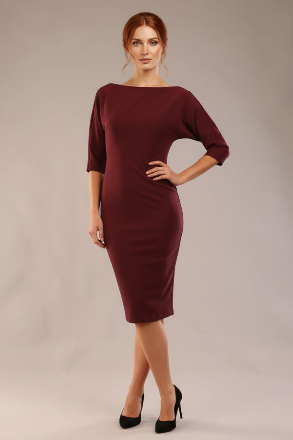 Model wearing the SEED Fulham pencil dress in port royale, showing the clean boat neckline and dolman sleeves (Port Royale)