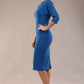 Model wearing the SEED Fulham pencil dress in port royale, showing the clean boat neckline and dolman sleeves (Sapphire Blue)