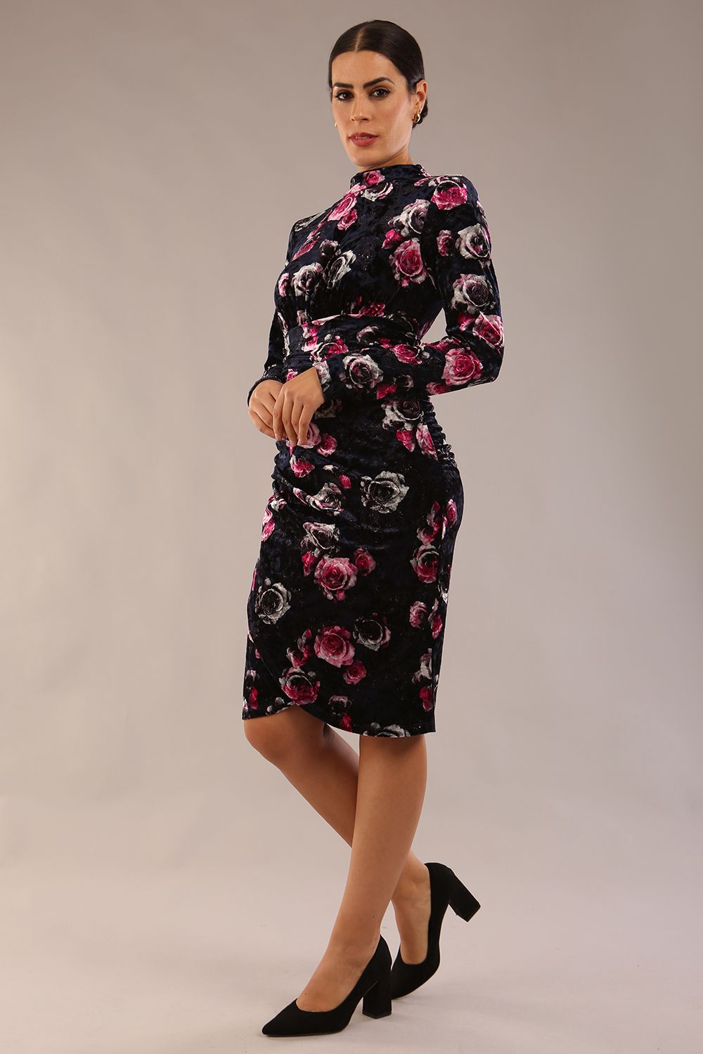 model is wearing a diva catwalk Firenze High-Neck Floral Velvet Wrap Dress long sleeves knee length with ruched sides.