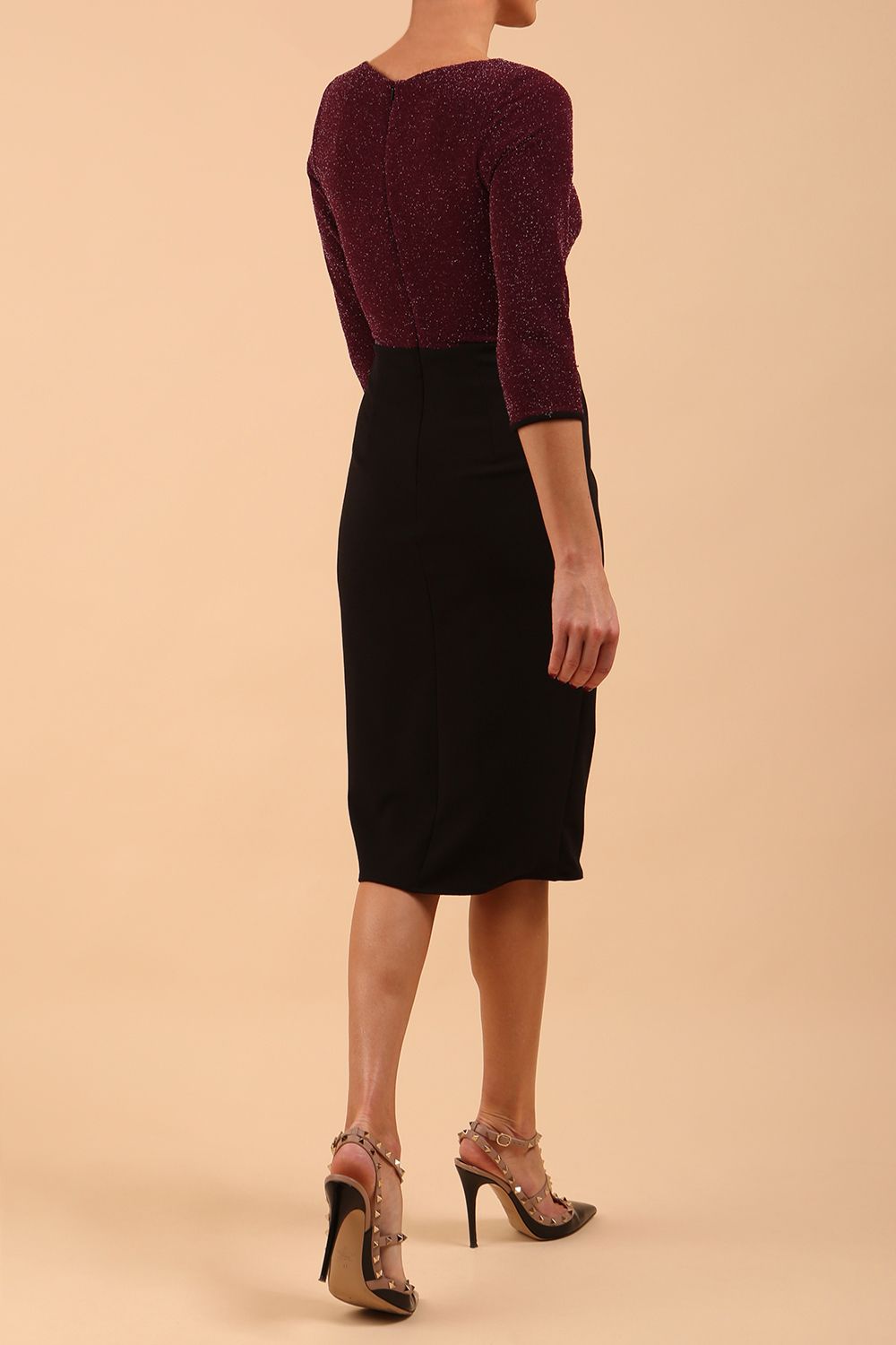 model is wearing diva catwalk contrast pencil dress with sleeve and asymmetric skirt detail in black and burgundy sparkle back