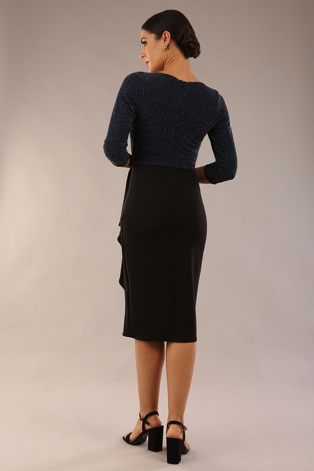 model is wearing diva catwalk contrast pencil dress with sleeve and asymmetric skirt detail in black and teal sparkle back