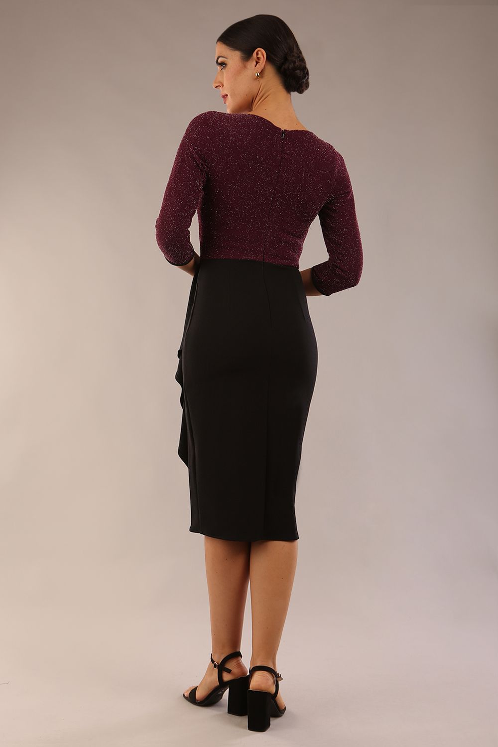 model is wearing diva catwalk contrast pencil dress with sleeve and asymmetric skirt detail in black and burgundy sparkle back