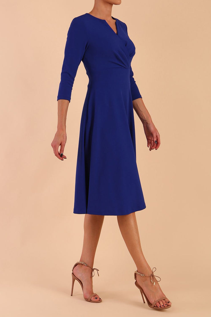  model is wearing diva catwalk january sleeved a-line v-neck dress in royal blue side