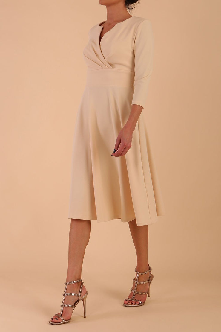 model is wearing diva catwalk january 3/4 sleeves a-line v-neck swing dress in beige front side