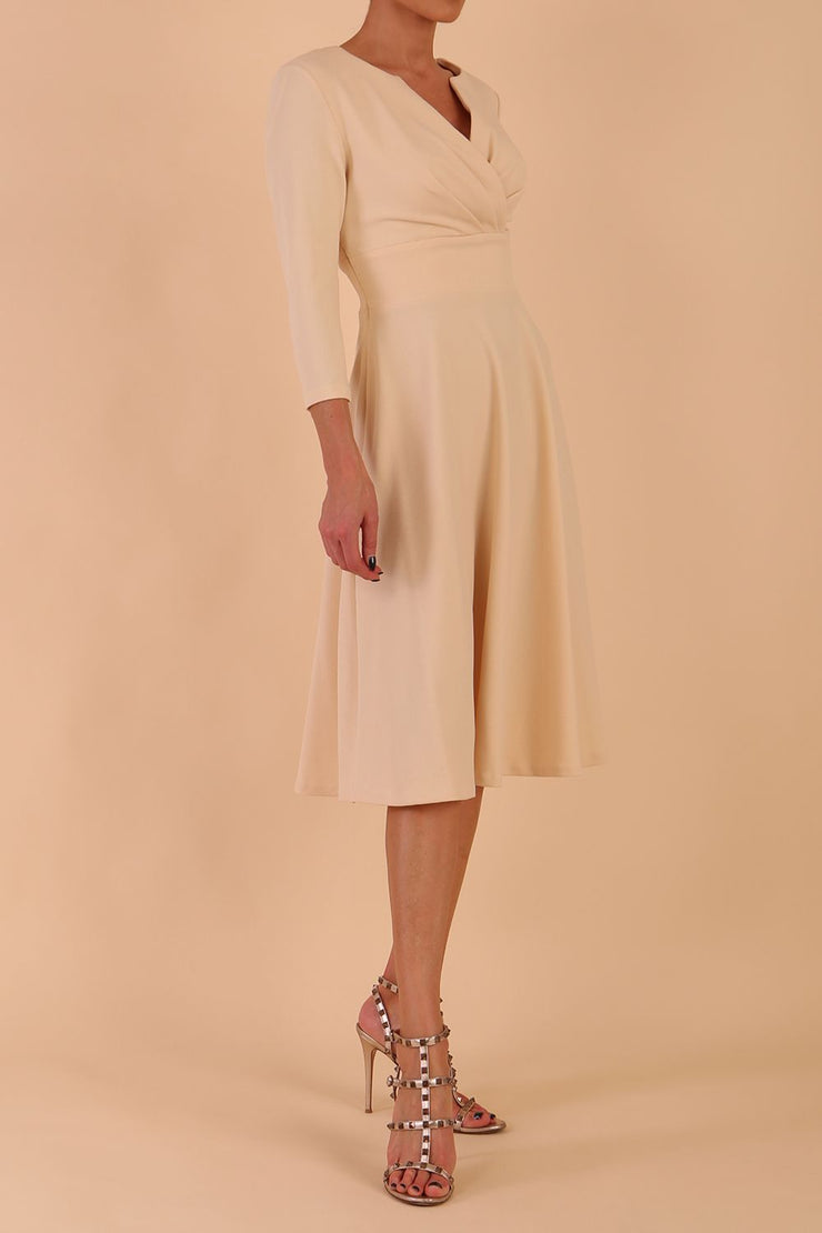model is wearing diva catwalk january 3/4 sleeves a-line v-neck swing dress in beige front side